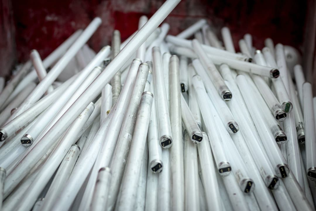 Box of spent fluorescent tubes ready for collection