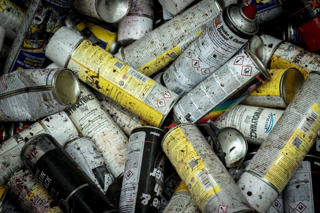 Spent aerosol cans collected for hazardous waste disposal