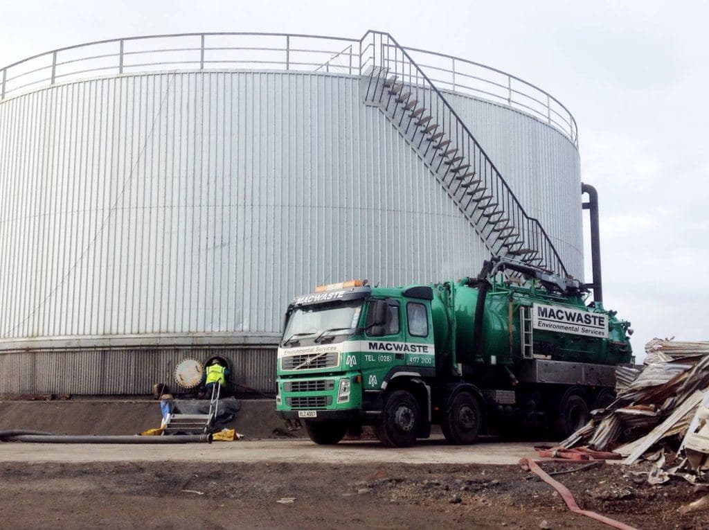 MacWaste vacuum tanker at an industrial storage tank site