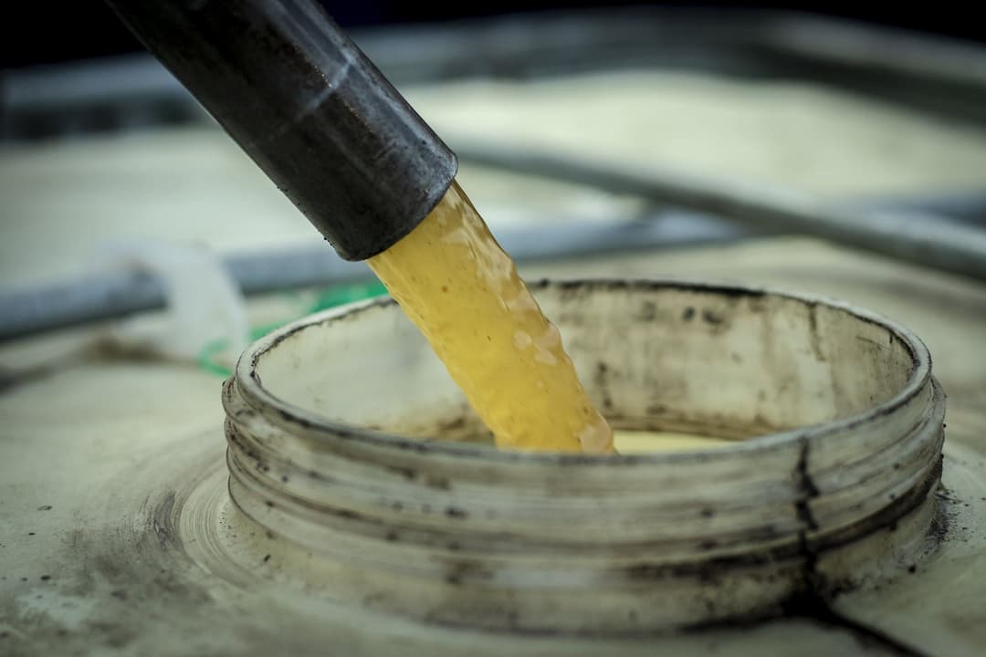 Waste mixed fuel drained and collected for safe disposal